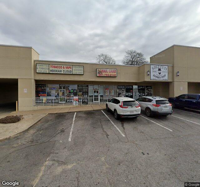Gold cuts barber shop storefront - Memphis